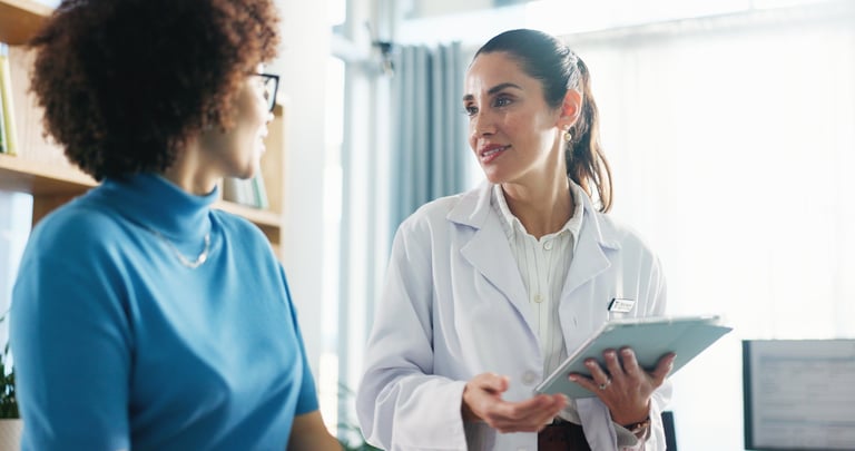 Tablet, checkup and woman with doctor in hospital for healthcare records with treatment plan